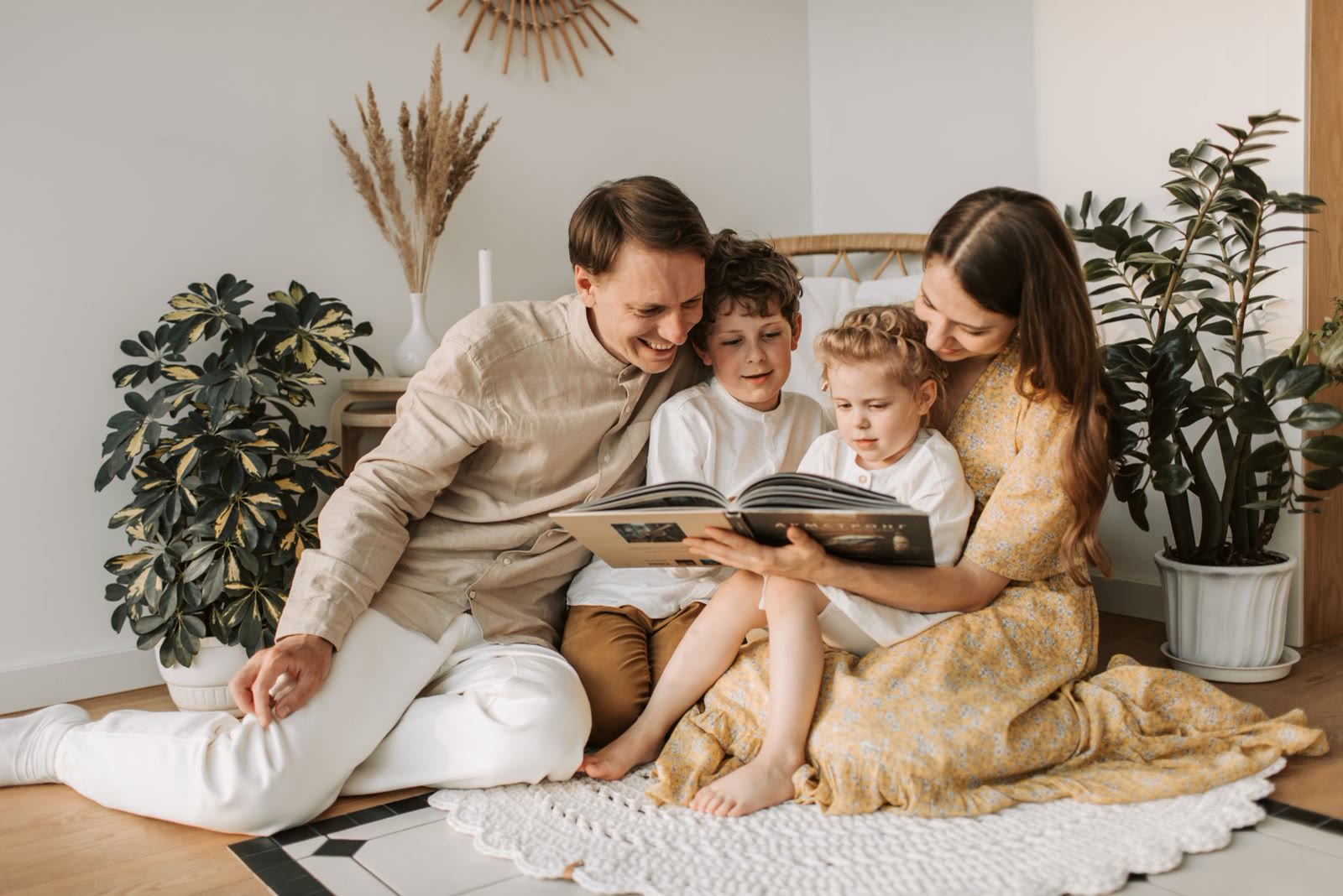 A family at home in a bright living room